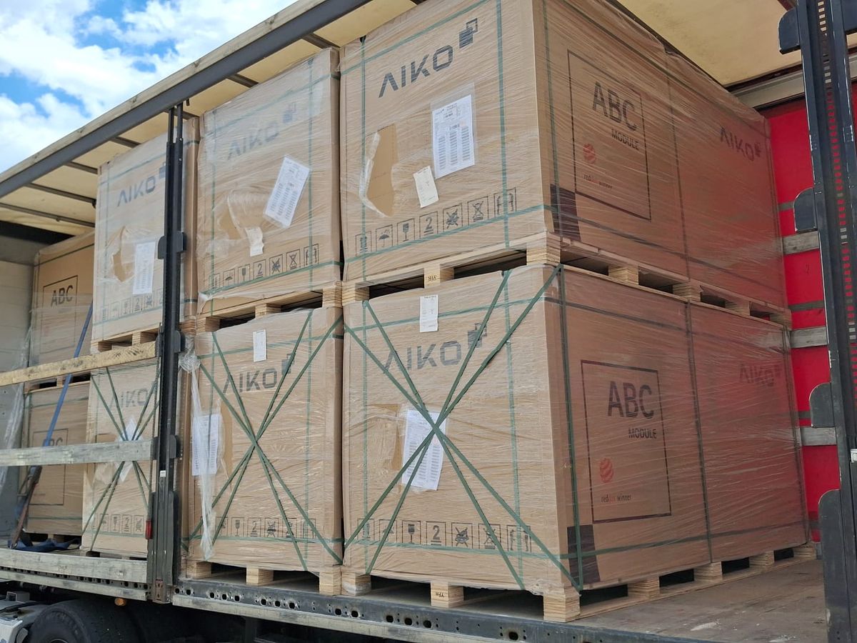 Pallets of AIKO ABC panels loaded on a truck