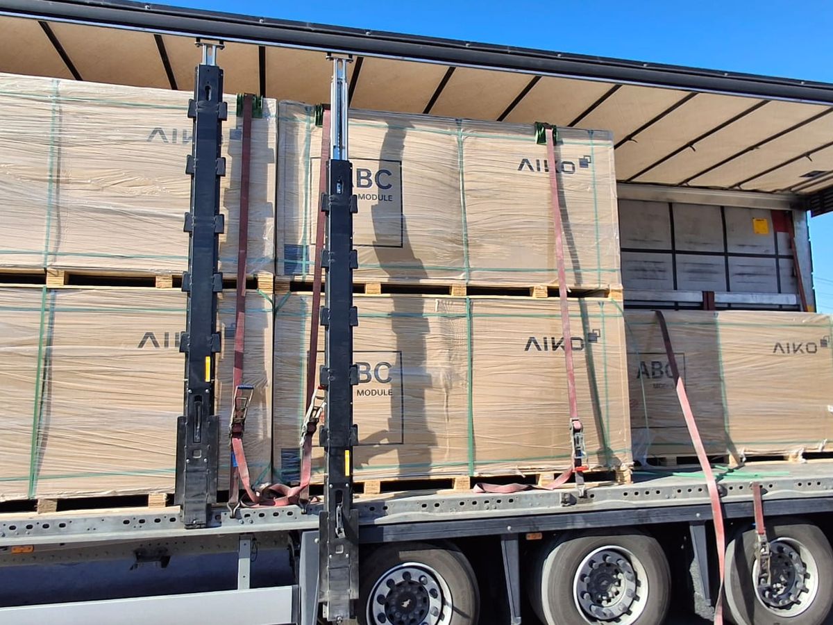 Truck full of AIKO panel pallets being unloaded